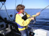 Ben Pigorsch reeling in a Lake Trout July 2006