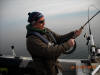 Shawn Sitar reeling in a Lake Trout