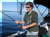 Ben Rausch reeling in a Lake Trout