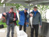 Erkki Kahkonen, Veli Hihonen, and Jarmo Huttenen with Lake Trout.