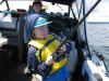 Alex Oysti (13) reeling in a Lake Trout