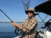 Jason Carstens Reeling in a Laker on the Johnson rod